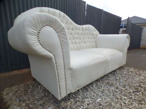 A gorgeous, quality PU leather Chesterfield style sofa w crystal like studs. MAGNIFICENT!!!