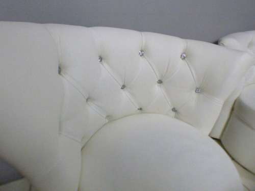 2 stunning, PU leather Chesterfield style chairs w crystal like studs. Classy & stylish! bid/chair