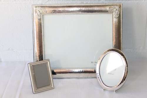 Three beautiful assorted silver metal/ silver plated free standing photo frames