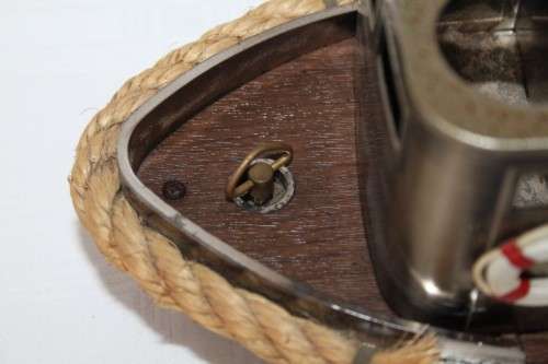 An amazing vintage tugboat decanter with a wind-up music box and four shot glasses