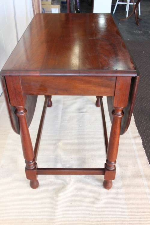 A wonderful solid teak "drop-leaf" table w/ side panels, very compact and perfect for limited space