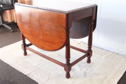 A wonderful solid teak "drop-leaf" table w/ side panels, very compact and perfect for limited space