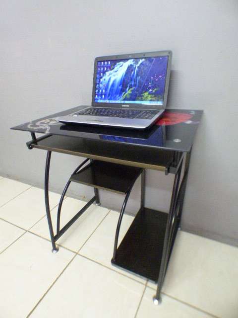 A lovely glass top writing/computer desk in good condition. Lovely in a ladies room.