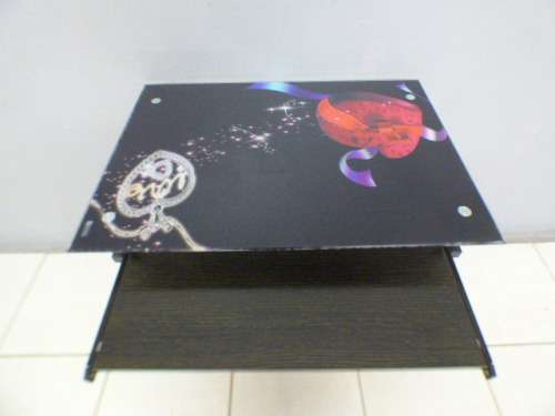 A lovely glass top writing/computer desk in good condition. Lovely in a ladies room.