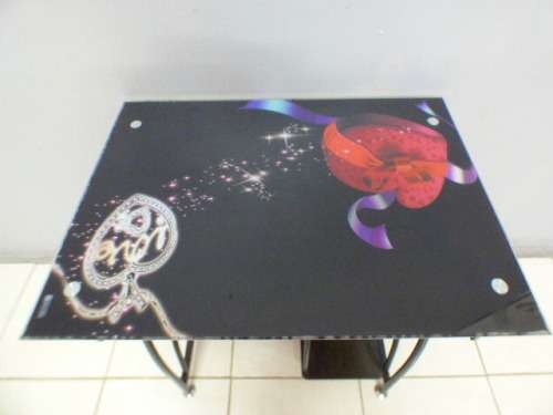 A lovely glass top writing/computer desk in good condition. Lovely in a ladies room.