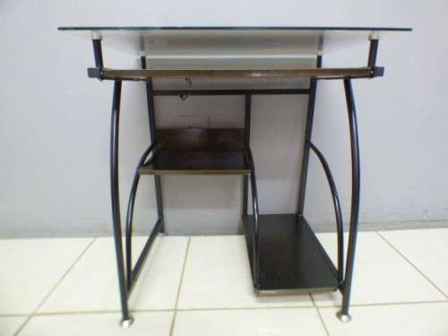 A lovely glass top writing/computer desk in good condition. Lovely in a ladies room.