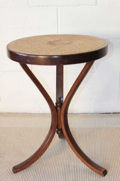 A stunning wicker-top occasional table with bentwood legs, something different in your home