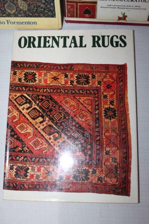 An assortment of informational "Oriental Rugs and Carpets" books