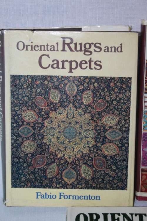 An assortment of informational "Oriental Rugs and Carpets" books