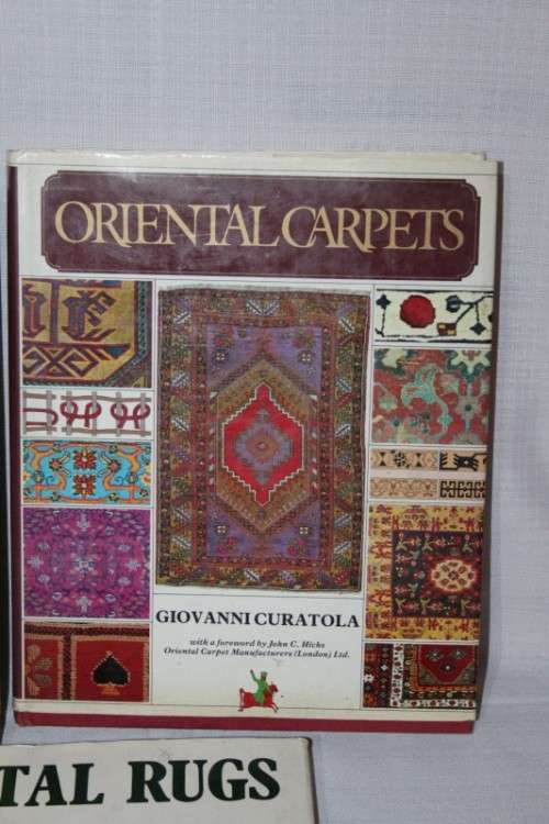 An assortment of informational "Oriental Rugs and Carpets" books