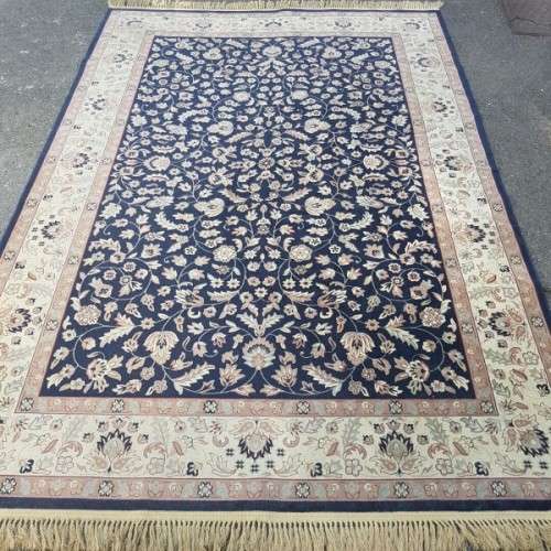 A superb Saudi made navy blue "silky" carpet with a stunning pattern in awesome condition