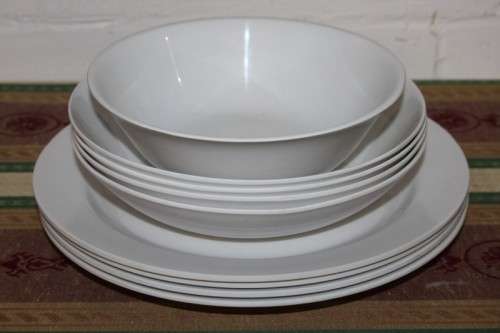 An assortment of plastic plates and bowls - perfect to take on camping trips