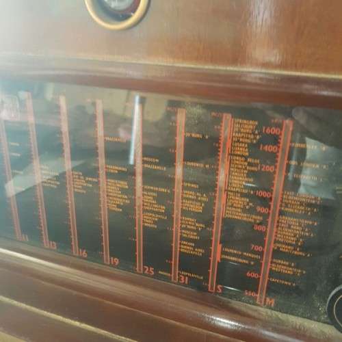 A vintage curved glass ball & claw radiogram display cabinet w/ original components for restoration