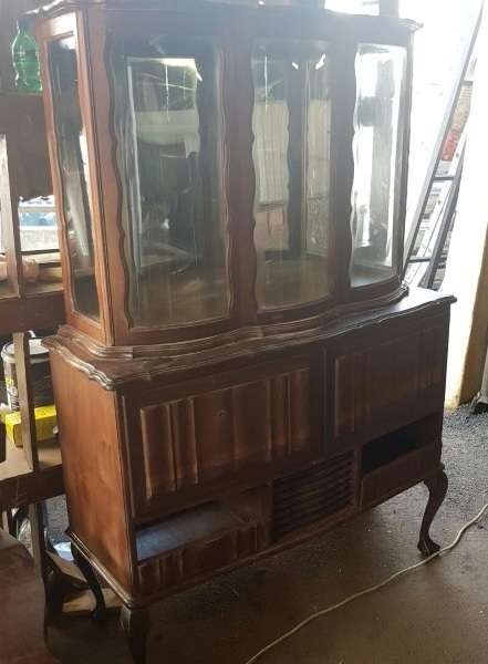 A vintage curved glass ball & claw radiogram display cabinet w/ original components for restoration
