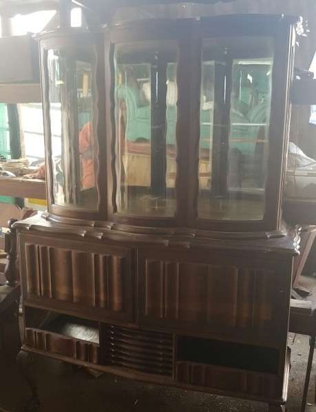 A vintage curved glass ball & claw radiogram display cabinet w/ original components for restoration