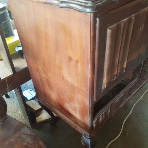 A vintage curved glass ball & claw radiogram display cabinet w/ original components for restoration