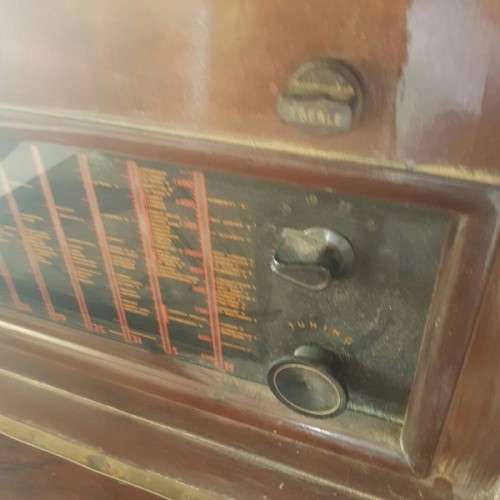A vintage curved glass ball & claw radiogram display cabinet w/ original components for restoration