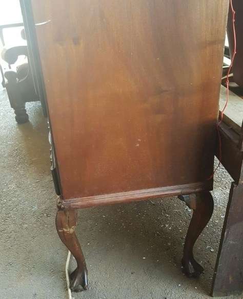 A vintage curved glass ball & claw radiogram display cabinet w/ original components for restoration