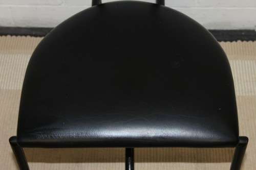 An awesome and sturdy black "Innovation" occasional chair with vinyl seat in great condition