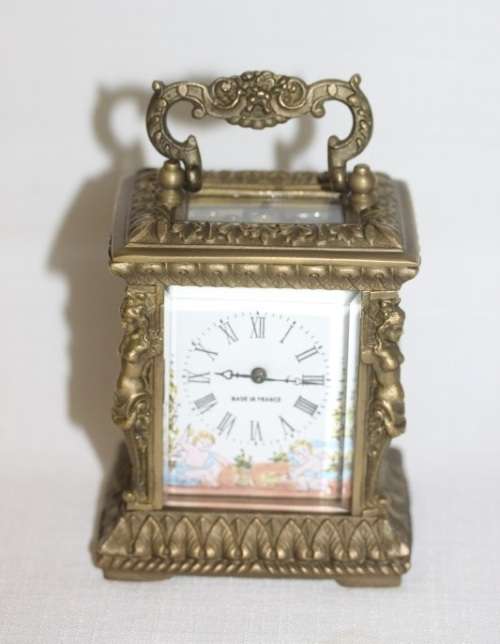 **RS17** A gorgeous ornate brass bevelled glass carriage clock w/ repousse detail & roman numerals