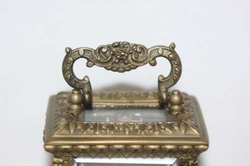 **RS17** A gorgeous ornate brass bevelled glass carriage clock w/ repousse detail & roman numerals