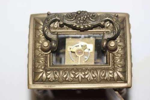 **RS17** A gorgeous ornate brass bevelled glass carriage clock w/ repousse detail & roman numerals