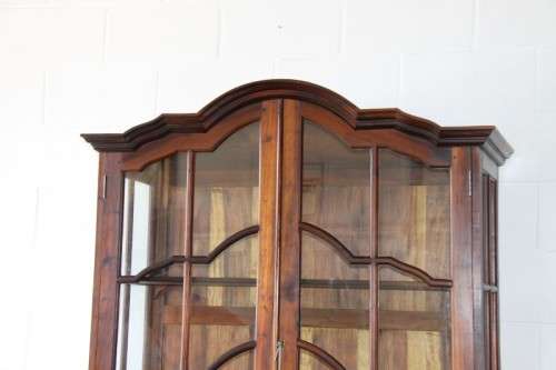 An incredible solid Stinkwood "gabled" display cabinet w/ large cottage pane doors & loads of space