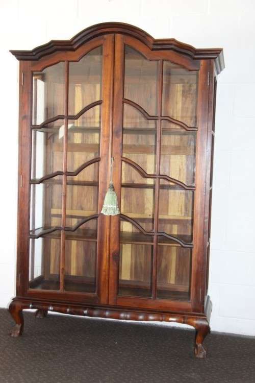 An incredible solid Stinkwood "gabled" display cabinet w/ large cottage pane doors & loads of space