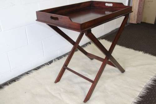 A gorgeous mahogany butlers tray w/ removable tray, perfect on the patio/pool area