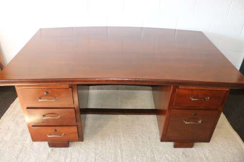 An awesome "curved front" office/ executive desk with ample drawers in great condition