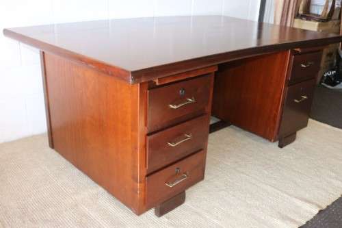 An awesome "curved front" office/ executive desk with ample drawers in great condition