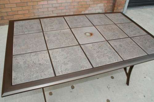 An awesome 6-seater "All-weather" wrought iron tiled top patio suite incl 6x large patio armchairs