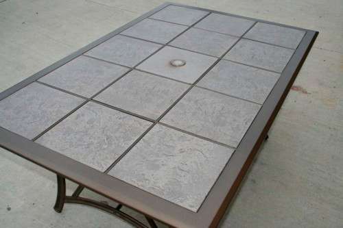 An awesome 6-seater "All-weather" wrought iron tiled top patio suite incl 6x large patio armchairs