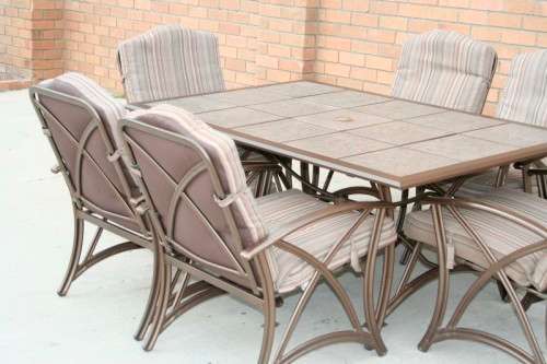 An awesome 6-seater "All-weather" wrought iron tiled top patio suite incl 6x large patio armchairs