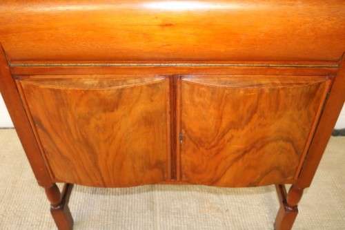 A remarkable Art Deco oak drinks cabinet with fall down counter and spacious cupboards