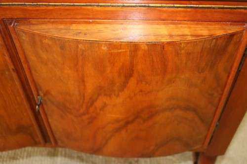 A remarkable Art Deco oak drinks cabinet with fall down counter and spacious cupboards