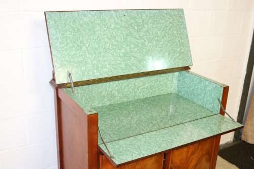 A remarkable Art Deco oak drinks cabinet with fall down counter and spacious cupboards