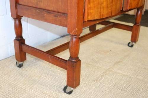 A remarkable Art Deco oak drinks cabinet with fall down counter and spacious cupboards