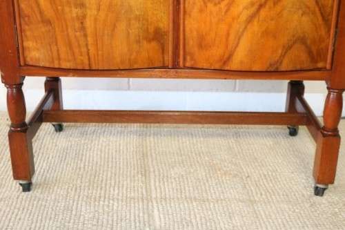 A remarkable Art Deco oak drinks cabinet with fall down counter and spacious cupboards