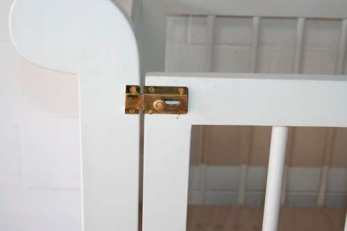 Price reduced!!! White babies crib bed/ cot w/ brass safety latches, fold-down side & large draw!