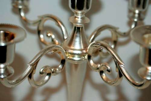 A fabulous tall 5-arm silver plated candelabra with ornate detailing and felt lined base