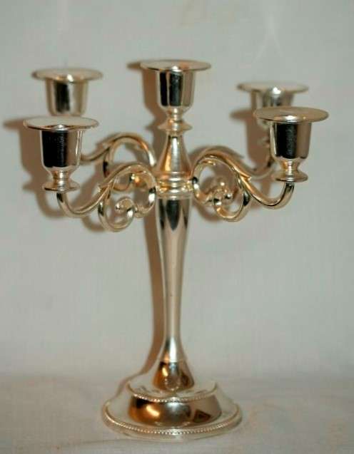 A fabulous tall 5-arm silver plated candelabra with ornate detailing and felt lined base