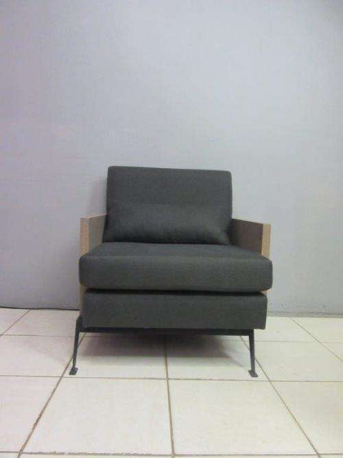 An absolutely gorgeous single seater sofa chair with futon and clean, stylish lines and wooden sides
