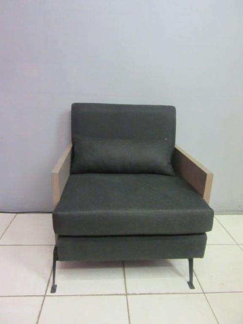 An absolutely gorgeous single seater sofa chair with futon and clean, stylish lines and wooden sides