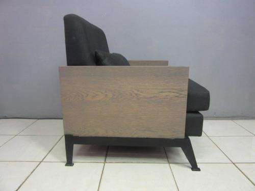 An absolutely gorgeous single seater sofa chair with futon and clean, stylish lines and wooden sides