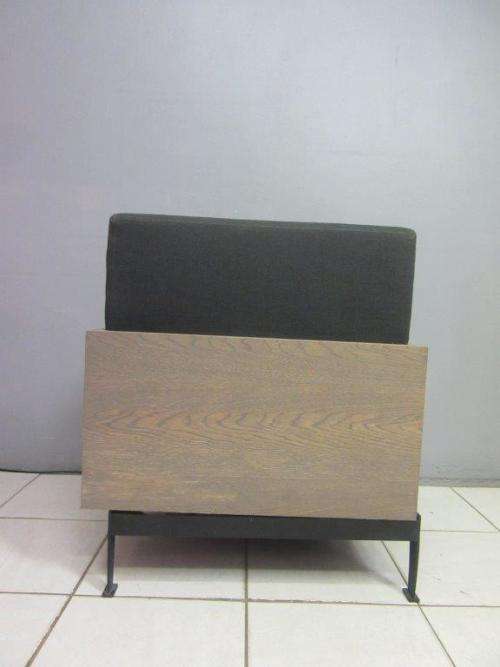 An absolutely gorgeous single seater sofa chair with futon and clean, stylish lines and wooden sides