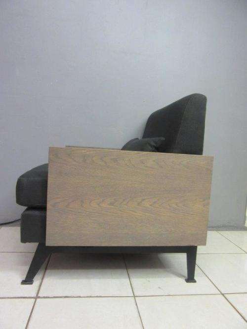 An absolutely gorgeous single seater sofa chair with futon and clean, stylish lines and wooden sides