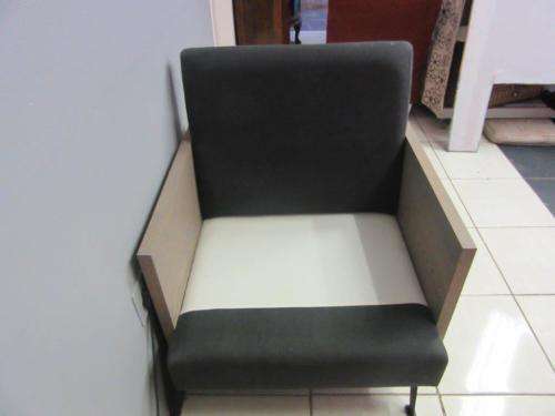 An absolutely gorgeous single seater sofa chair with futon and clean, stylish lines and wooden sides