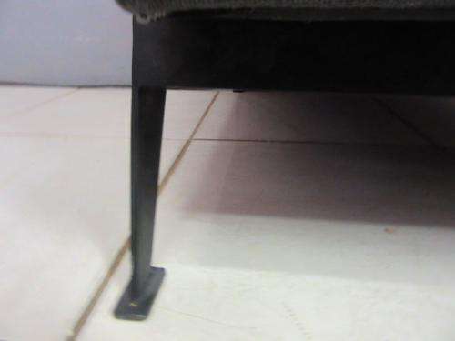 An absolutely gorgeous single seater sofa chair with futon and clean, stylish lines and wooden sides