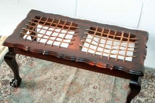 A stunning and well-made vintage solid imbuia ball & claw riempie foot stool with leather riempies